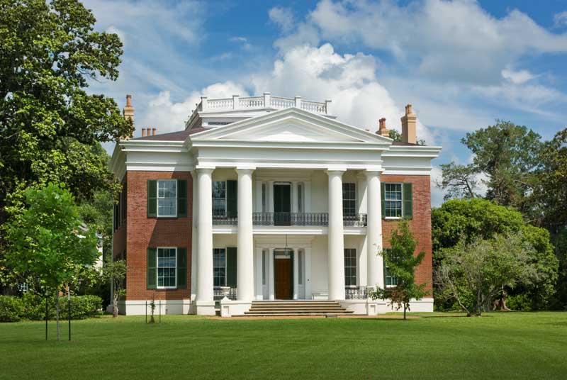 Exterior shutter styles shown on a historic plantation-plain house.